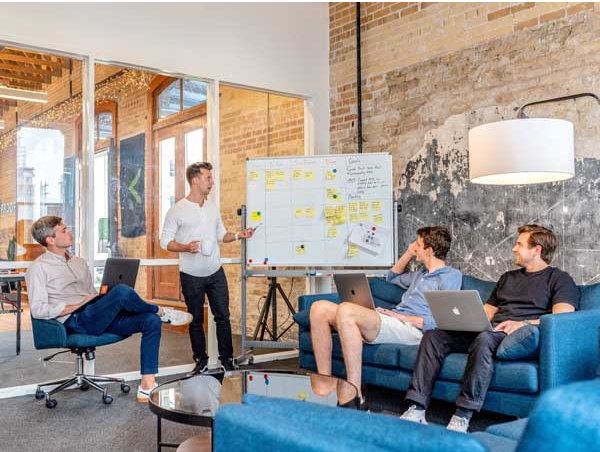 Team Meeting Around Whiteboard