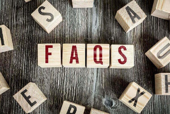 Wooden blocks wth the text FAQs.